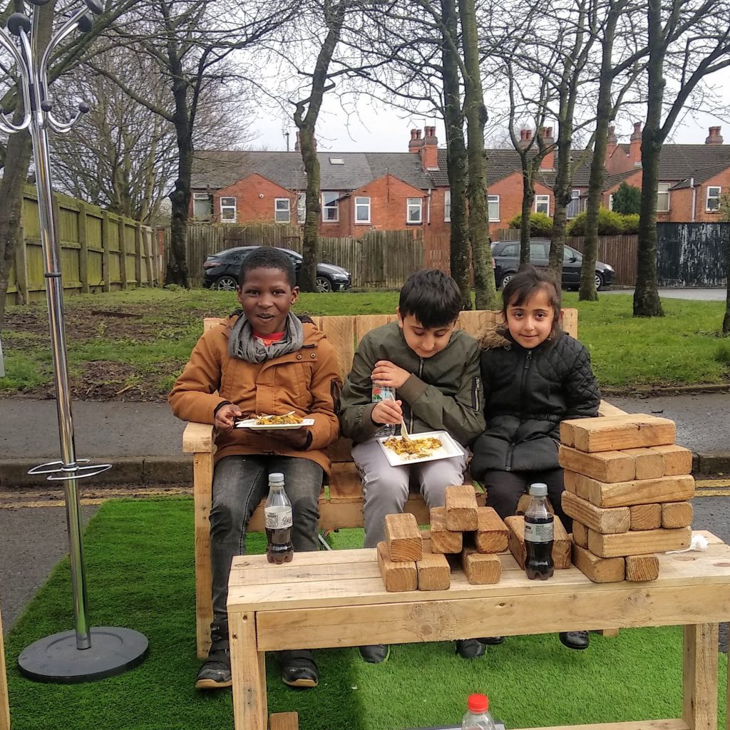 Children on seat in street