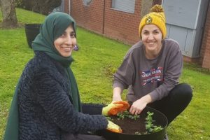 2 women planting